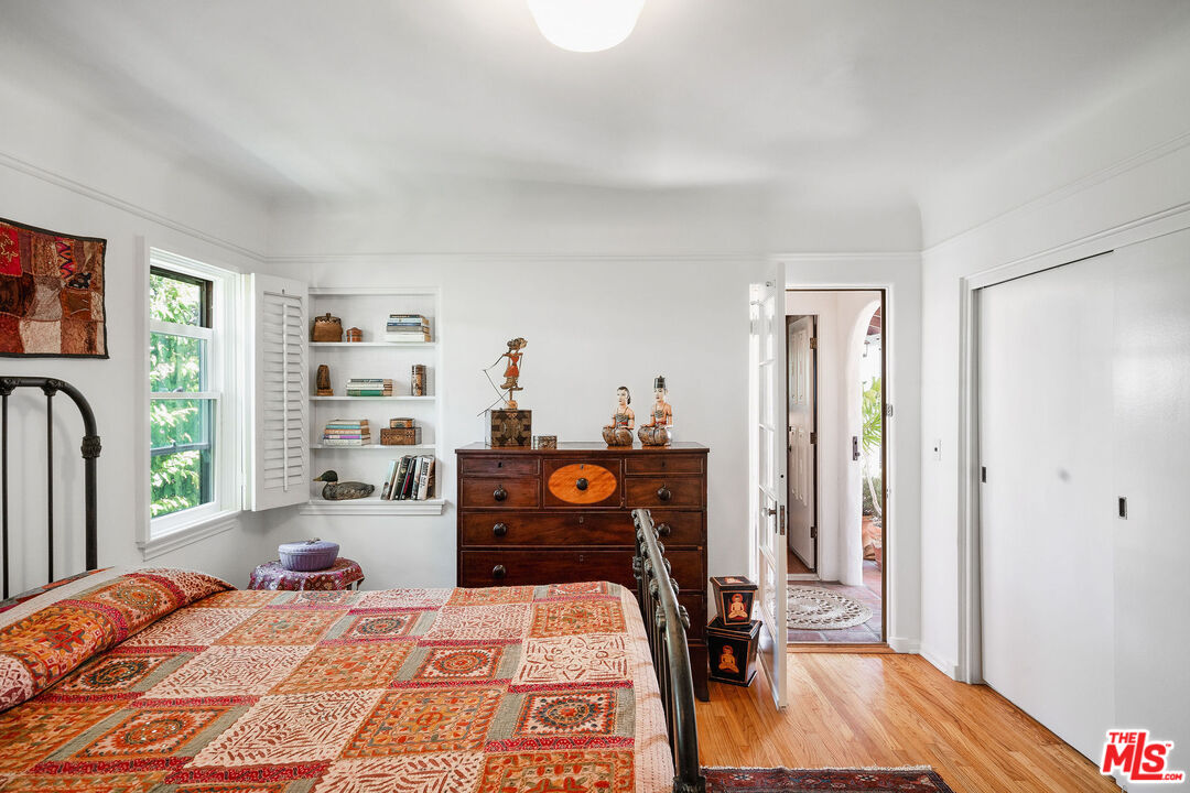 447 9th Street Santa Monica, CA 90402 - Photo 25 of 58 a bedroom with a bed and wooden floor