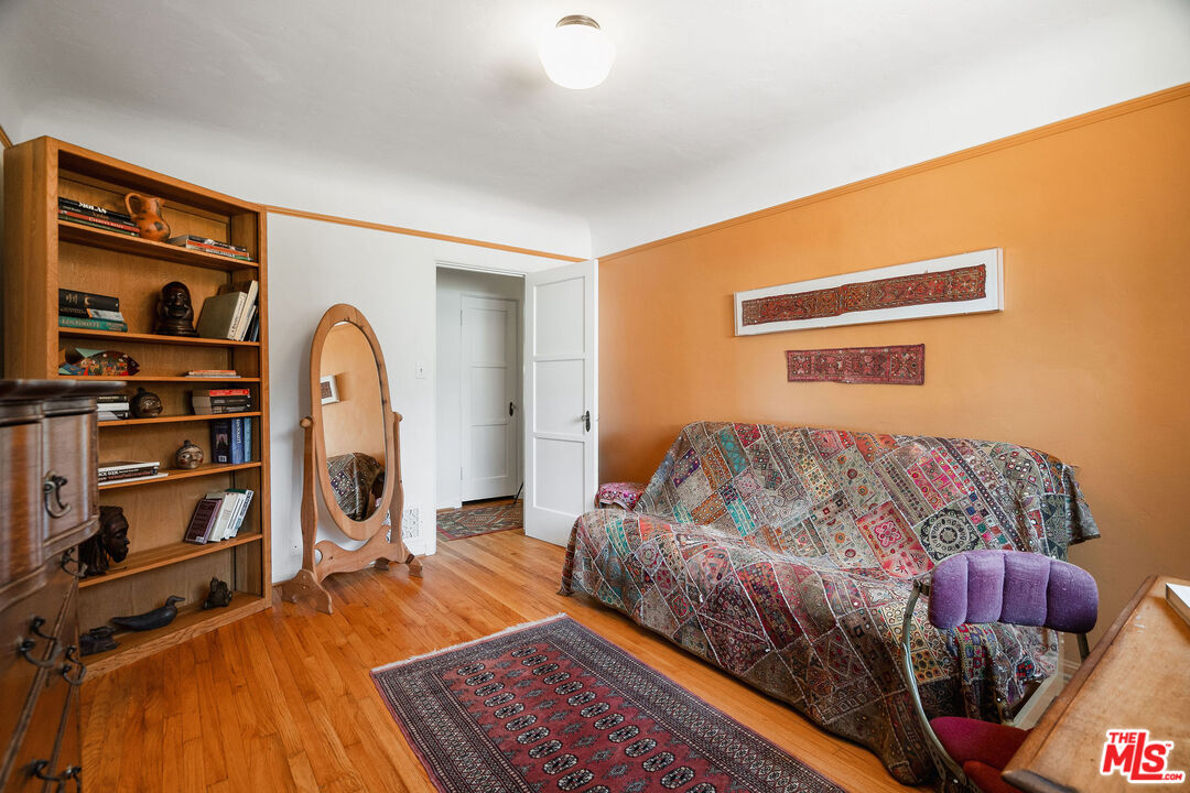 447 9th Street Santa Monica, CA 90402 - Photo 31 of 58 a bedroom with a bed and a book shelf