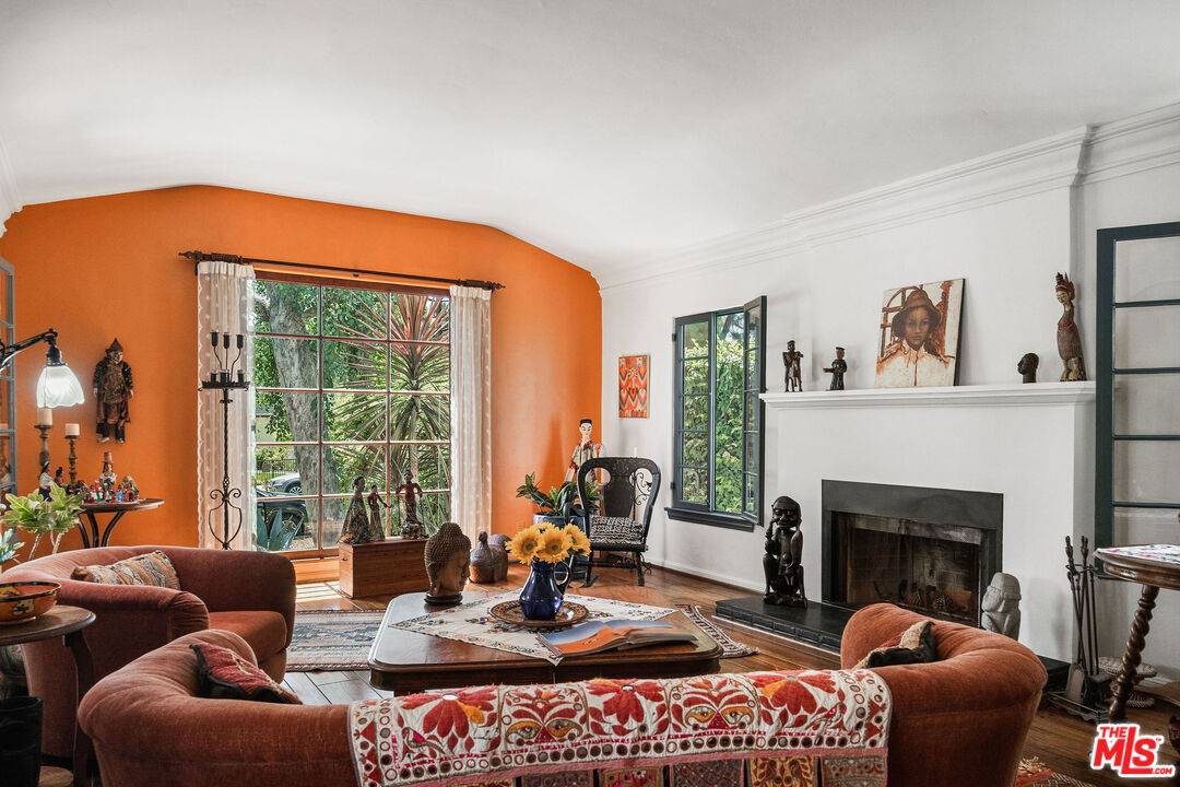 447 9th Street Santa Monica, CA 90402 - Photo 8 of 58 a living room with furniture a fireplace and floor to ceiling windows
