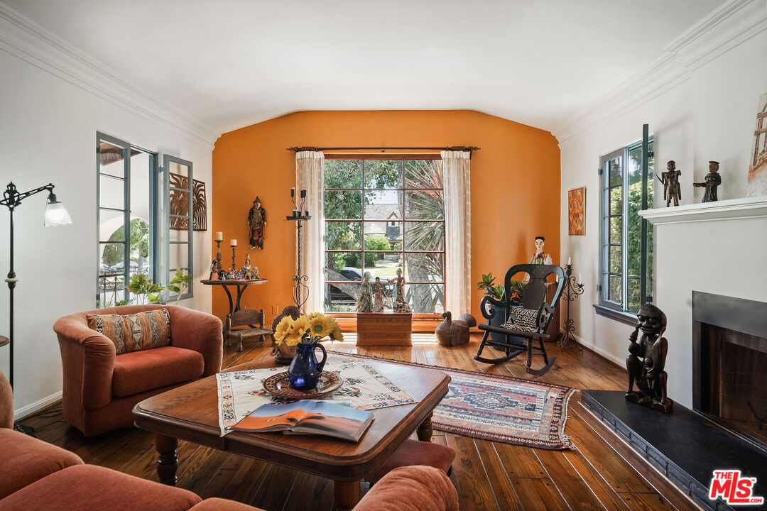 447 9th Street Santa Monica, CA 90402 - Photo 9 of 58 a living room with furniture a fireplace and a table