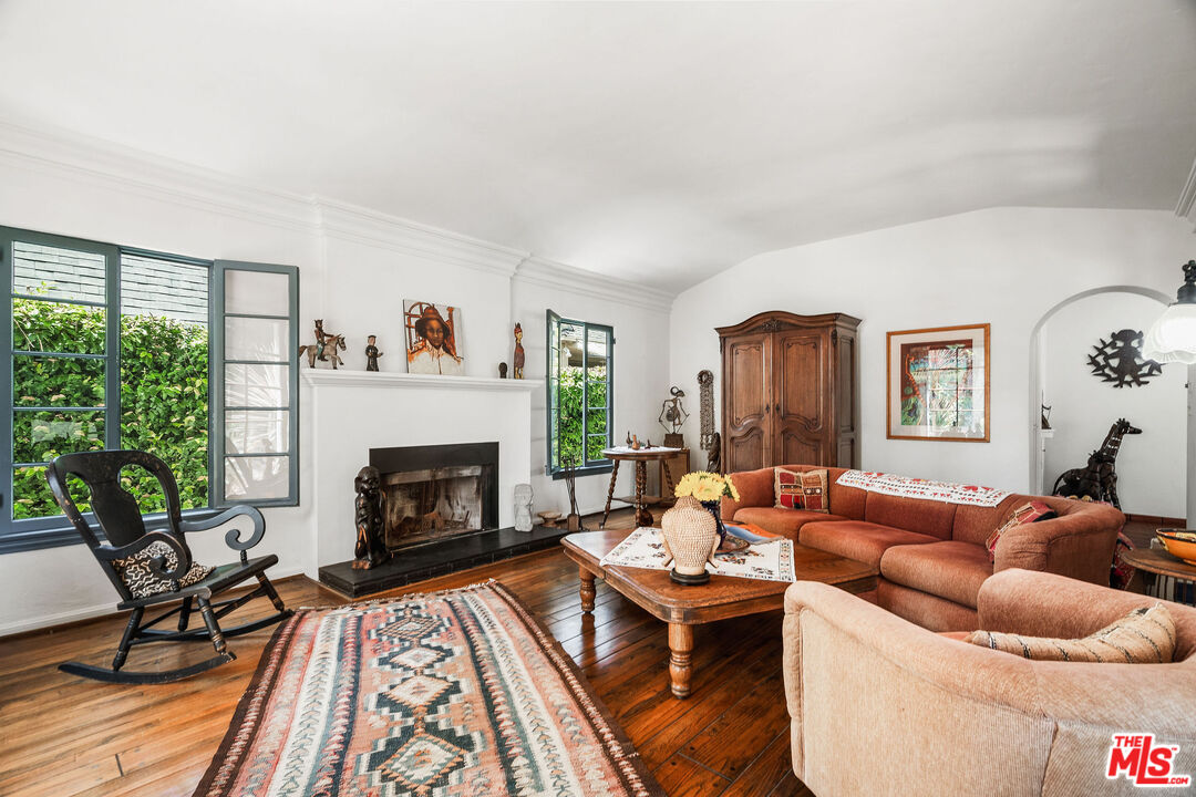 447 9th Street Santa Monica, CA 90402 - Photo 10 of 58 a living room with furniture and a fireplace