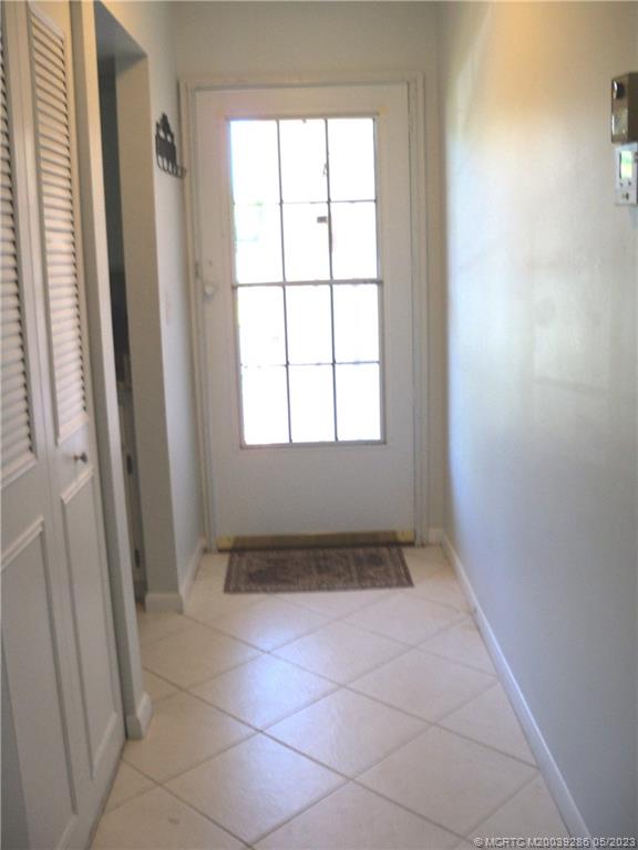 1901 Southwest Palm City Road, Unit A 1 Stuart, FL 34994 - Photo 2 of 42 Tiled foyer