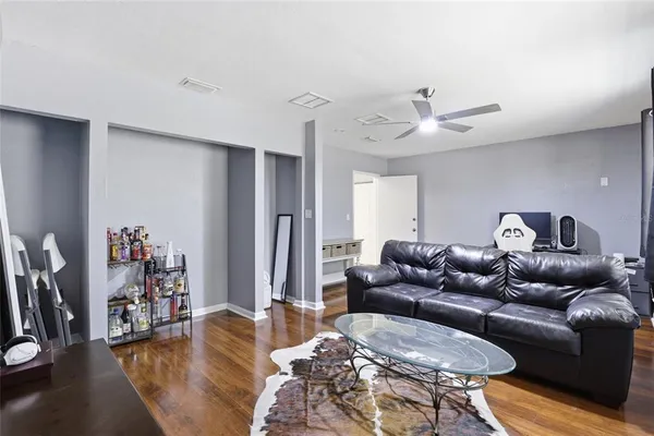 a living room with furniture and a large window