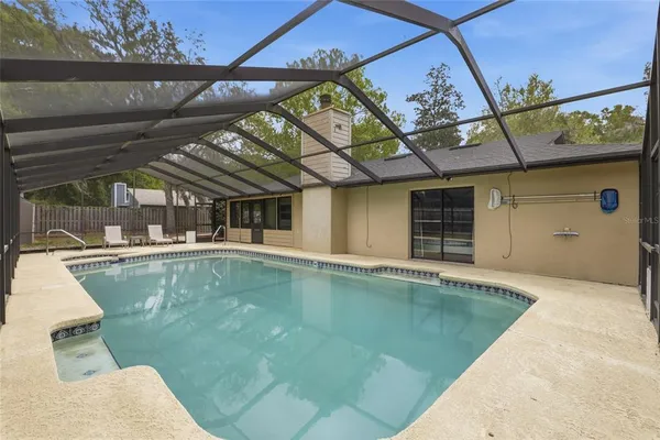 a view of a swimming pool with a patio