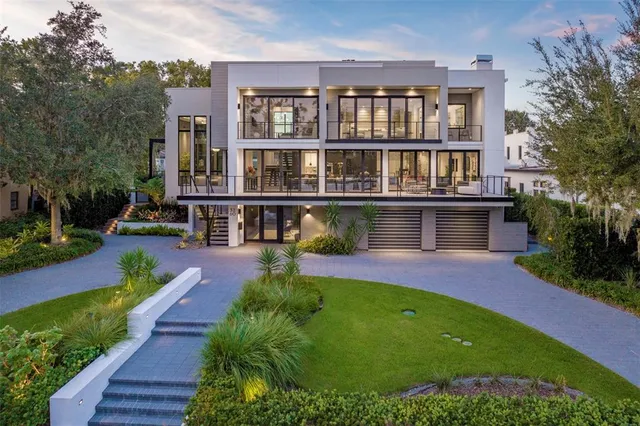 a house with swimming pool in front of it