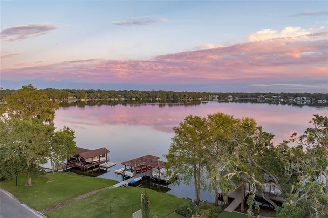 a view of a lake with houses in the back