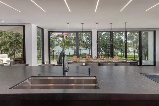 a room with lots of furniture and large windows