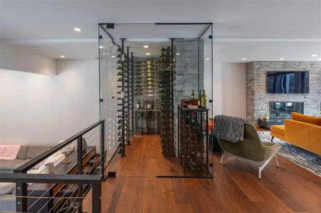 a very nice looking room with wooden floor and windows