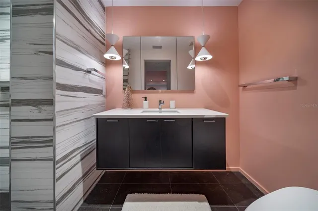 a bathroom with a sink and a mirror