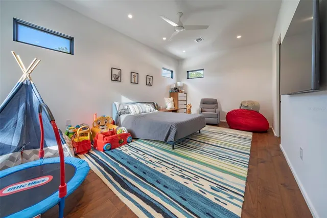 a bedroom with two beds and a couch