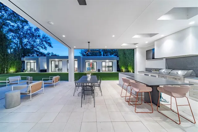 a patio with table and chairs