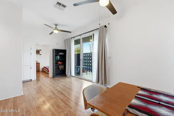 a view of a room with furniture and wooden floor