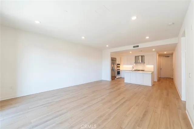 a view of kitchen with wooden floor