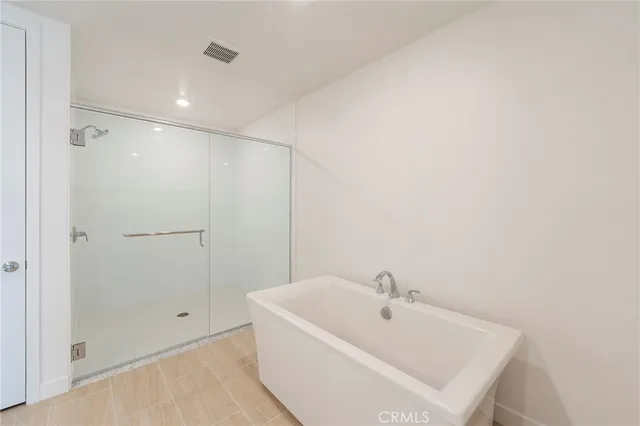 a white bath tub sitting in a bathroom