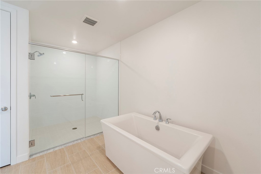 3211 Rivington Irvine, CA 92612 - Photo 20 of 49 a white bath tub sitting in a bathroom