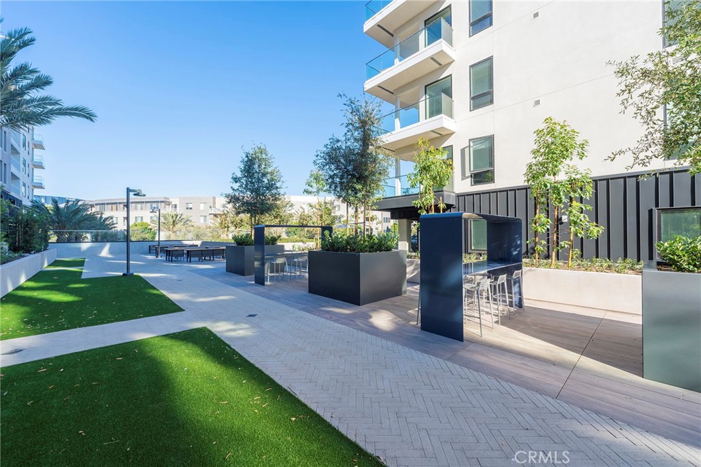 3211 Rivington Irvine, CA 92612 - Photo 36 of 49 a view of a street with a building in the background