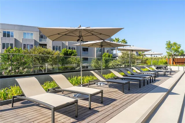 a view of swimming pool with outdoor seating