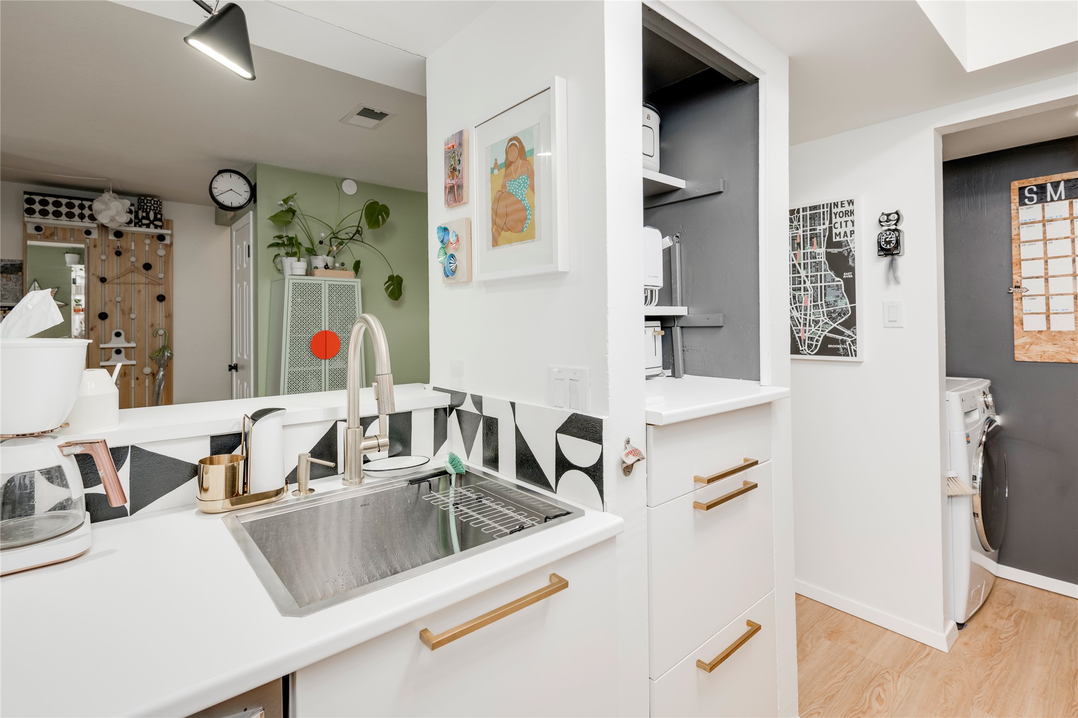 3627 Menchaca Road, Unit 214 Austin, TX 78704 - Photo 2 of 28 Functional kitchen with ample counter space and convenient laundry area access.