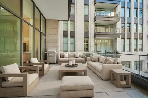 a bathroom with a granite countertop sink toilet a shower and a mirror