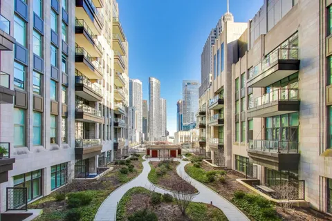 a view of a room with lots of white furniture