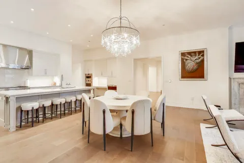 a bathroom with a double vanity sink a mirror and a bathtub