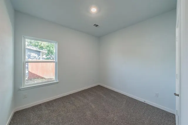 a view of a kitchen with a sink and chandelier
