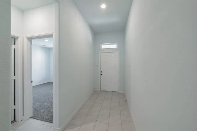 a bathroom with a granite countertop toilet a sink and bathtub