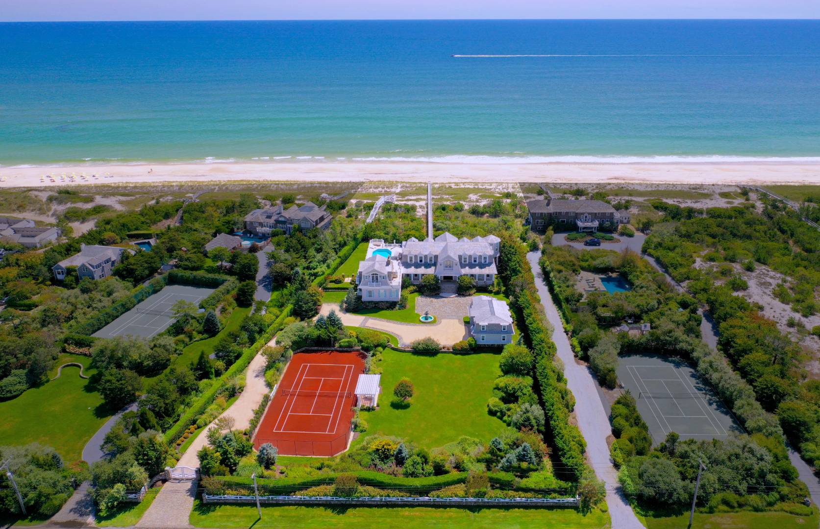 124 Dune Road Quogue, NY 11959 - Photo 1 of 34 a view of a yard with an outdoor space