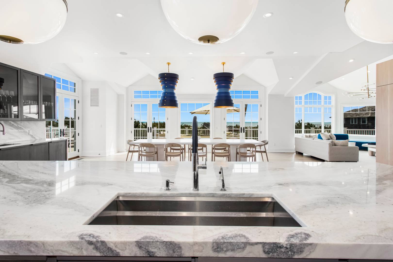 124 Dune Road Quogue, NY 11959 - Photo 12 of 34 a view of a living room kitchen with stainless steel appliances cabinets