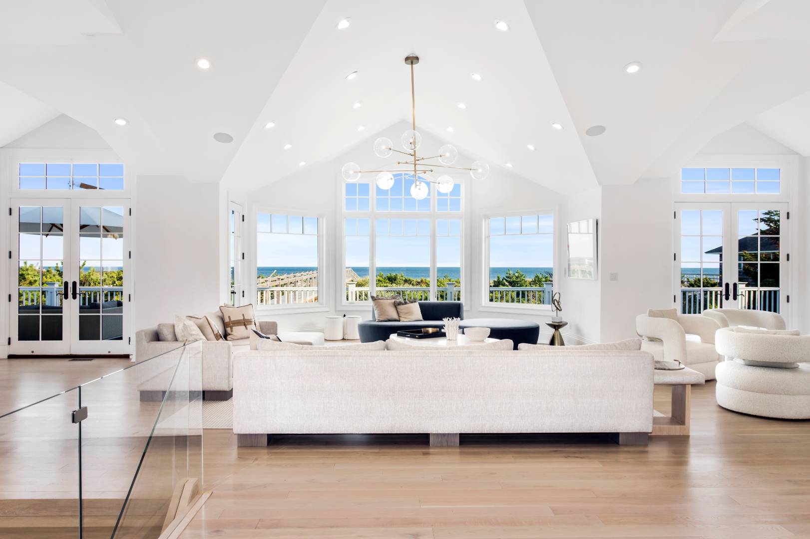 124 Dune Road Quogue, NY 11959 - Photo 15 of 34 a large room with lots of white furniture