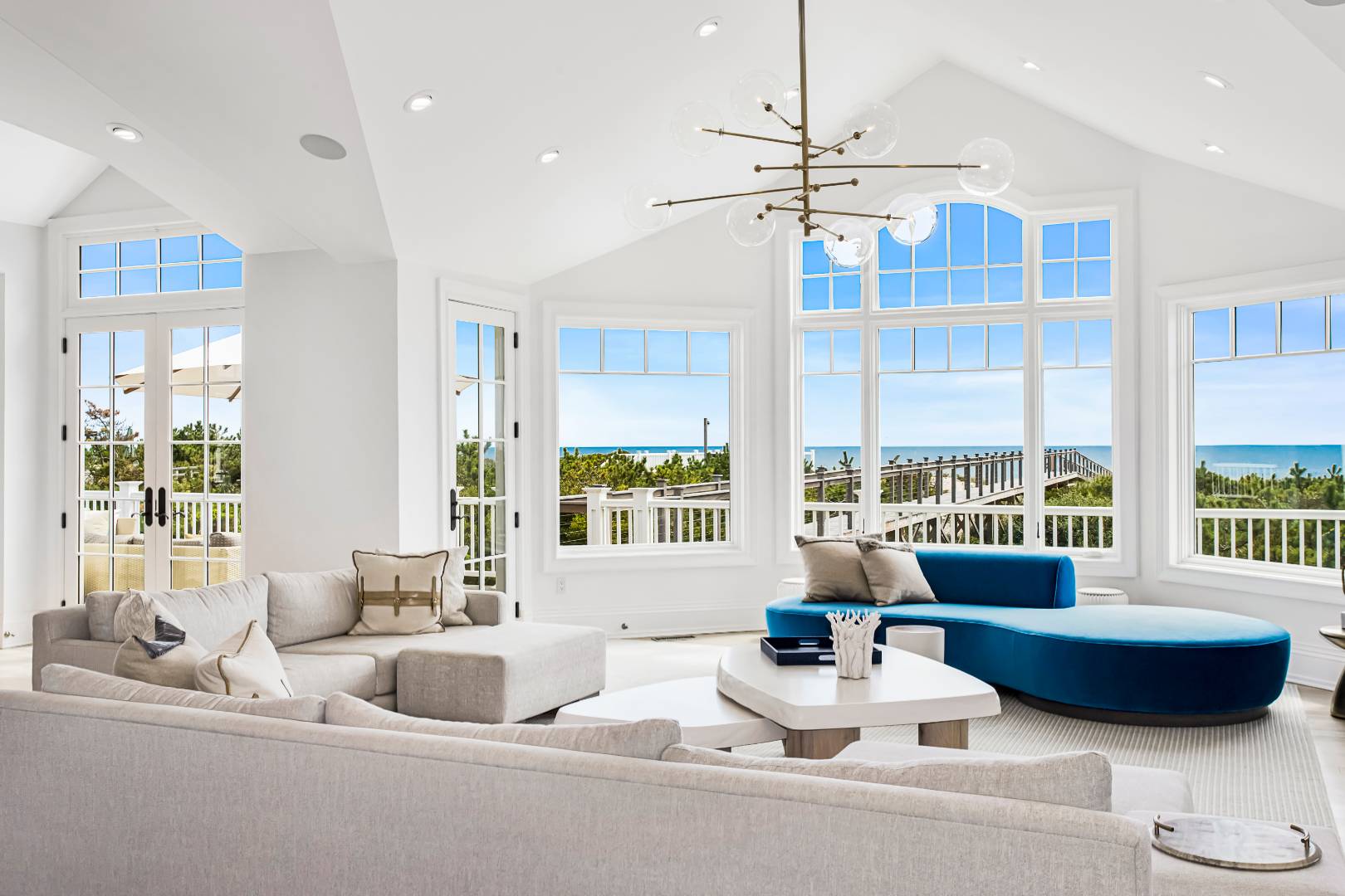 124 Dune Road Quogue, NY 11959 - Photo 16 of 34 a living room with furniture and a large window