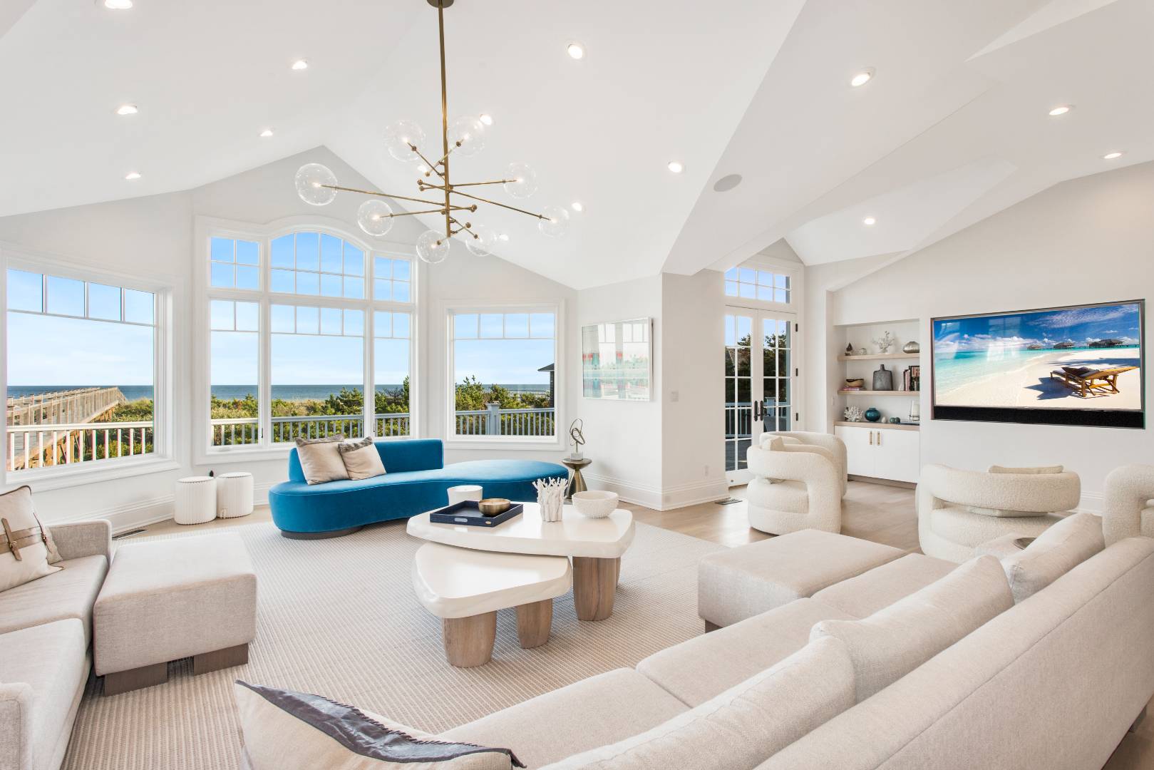 124 Dune Road Quogue, NY 11959 - Photo 18 of 34 a living room with furniture and a large window