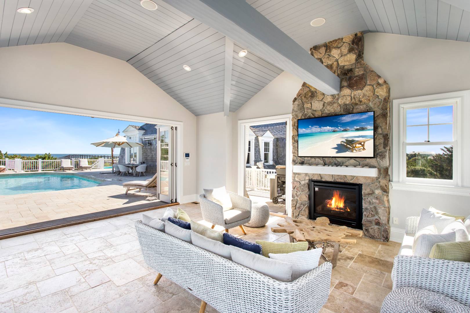 124 Dune Road Quogue, NY 11959 - Photo 20 of 34 a living room with furniture and a fireplace