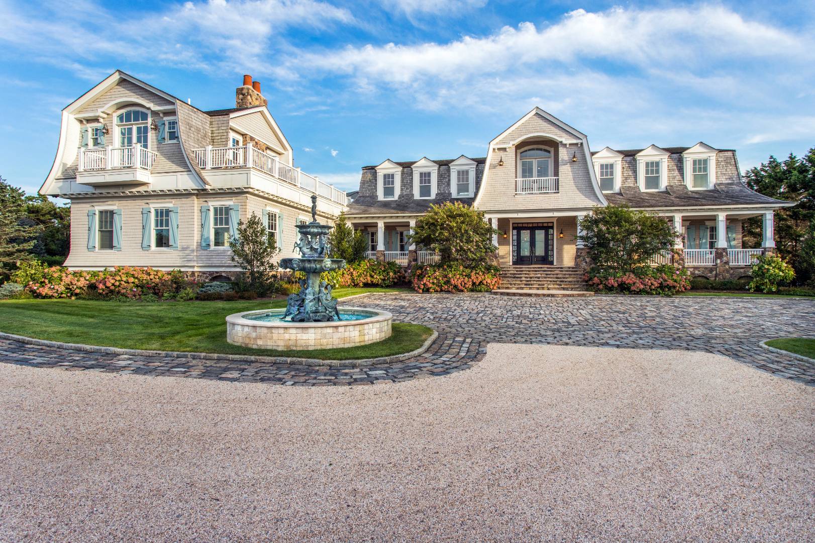 124 Dune Road Quogue, NY 11959 - Photo 3 of 34 a front view of a house with a yard