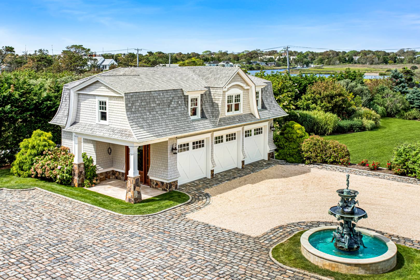 124 Dune Road Quogue, NY 11959 - Photo 22 of 34 a aerial view of a house with a yard and potted plants