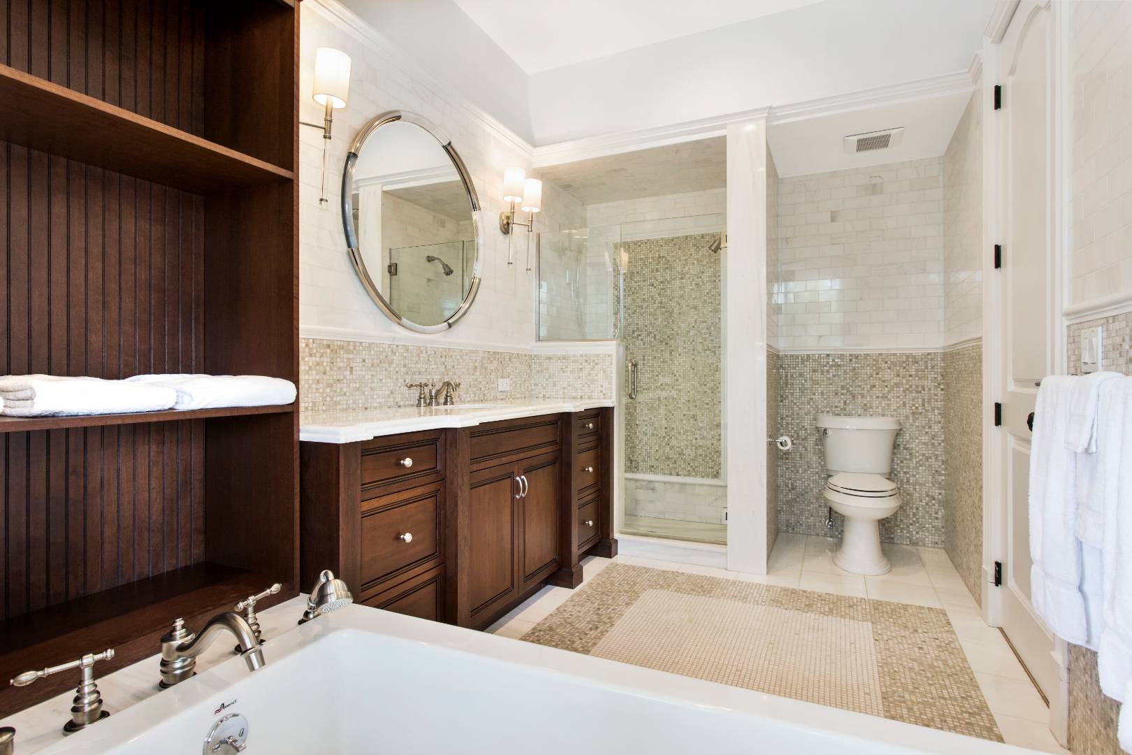 124 Dune Road Quogue, NY 11959 - Photo 27 of 34 a spacious bathroom with a sink and a mirror