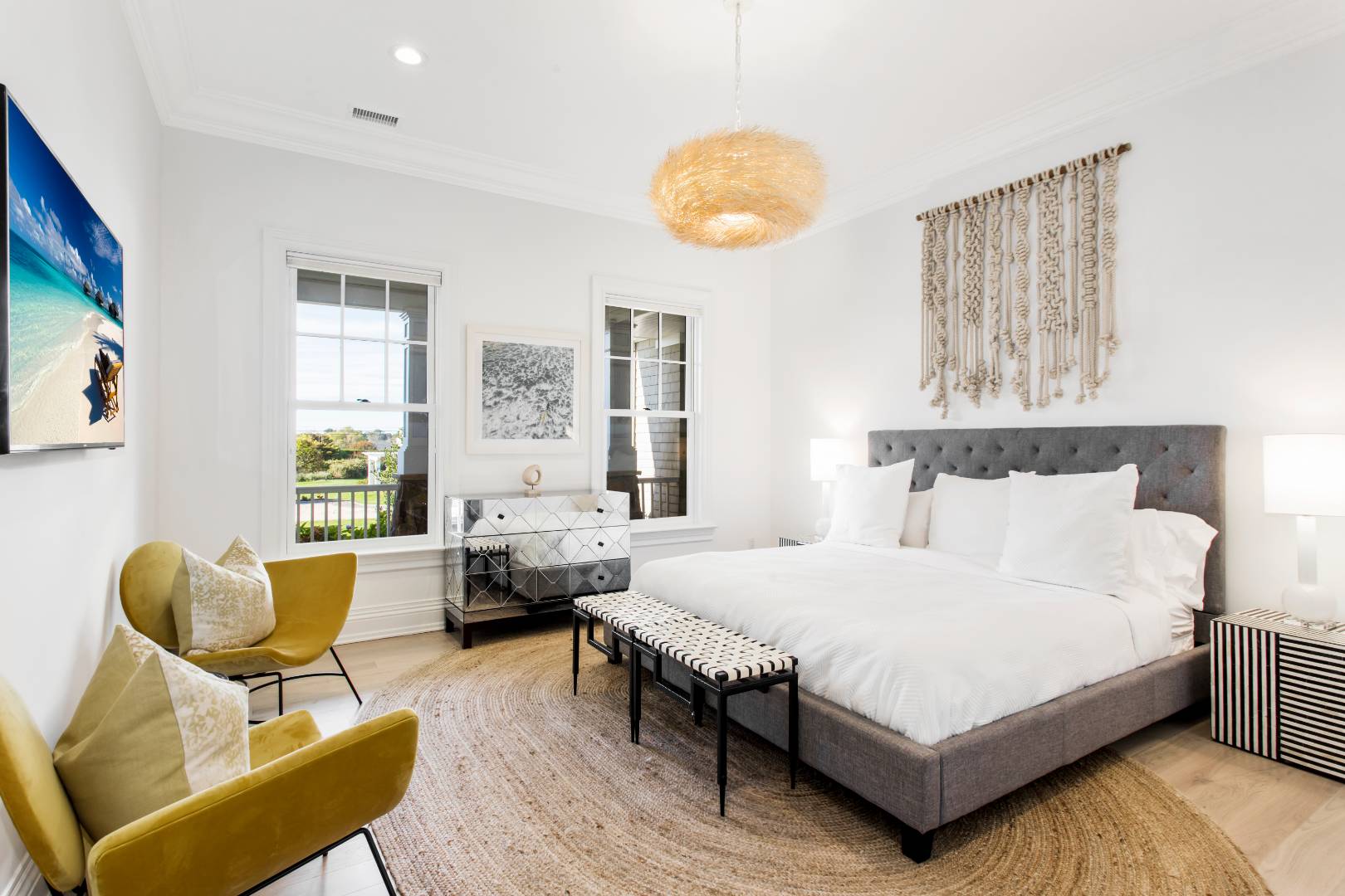 124 Dune Road Quogue, NY 11959 - Photo 32 of 34 a bedroom with a bed and wooden floor