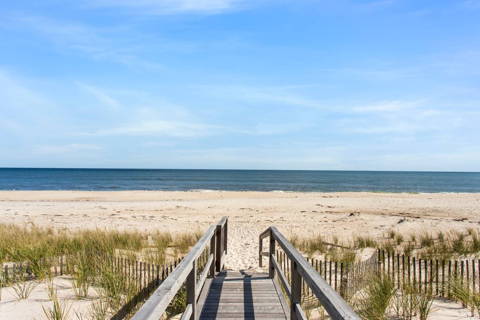 124 Dune Road Quogue, NY 11959 - Photo 9 of 34 a view of ocean from a balcony