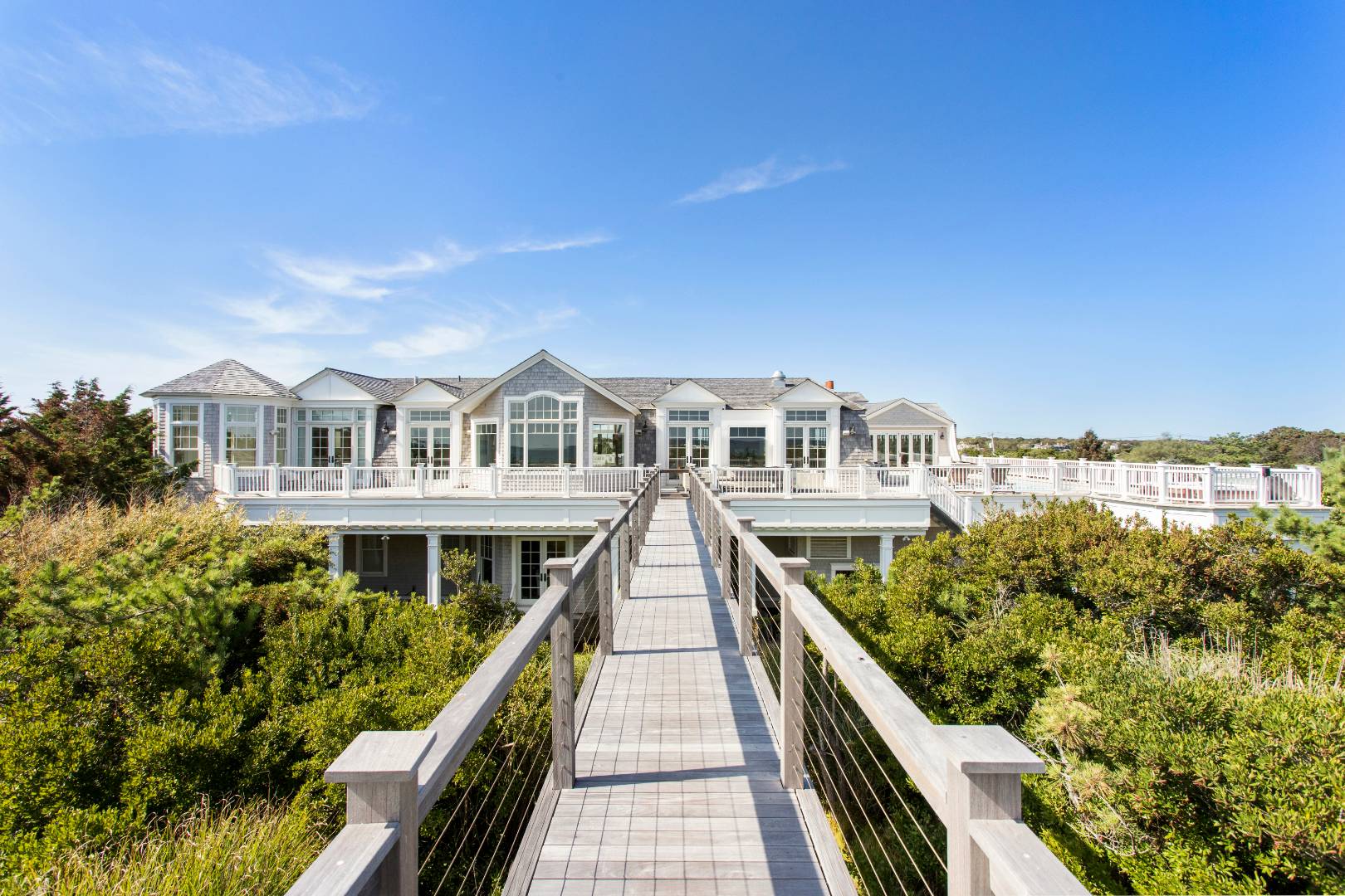 124 Dune Road Quogue, NY 11959 - Photo 10 of 34 a view of residential houses with yard and mountain view in back