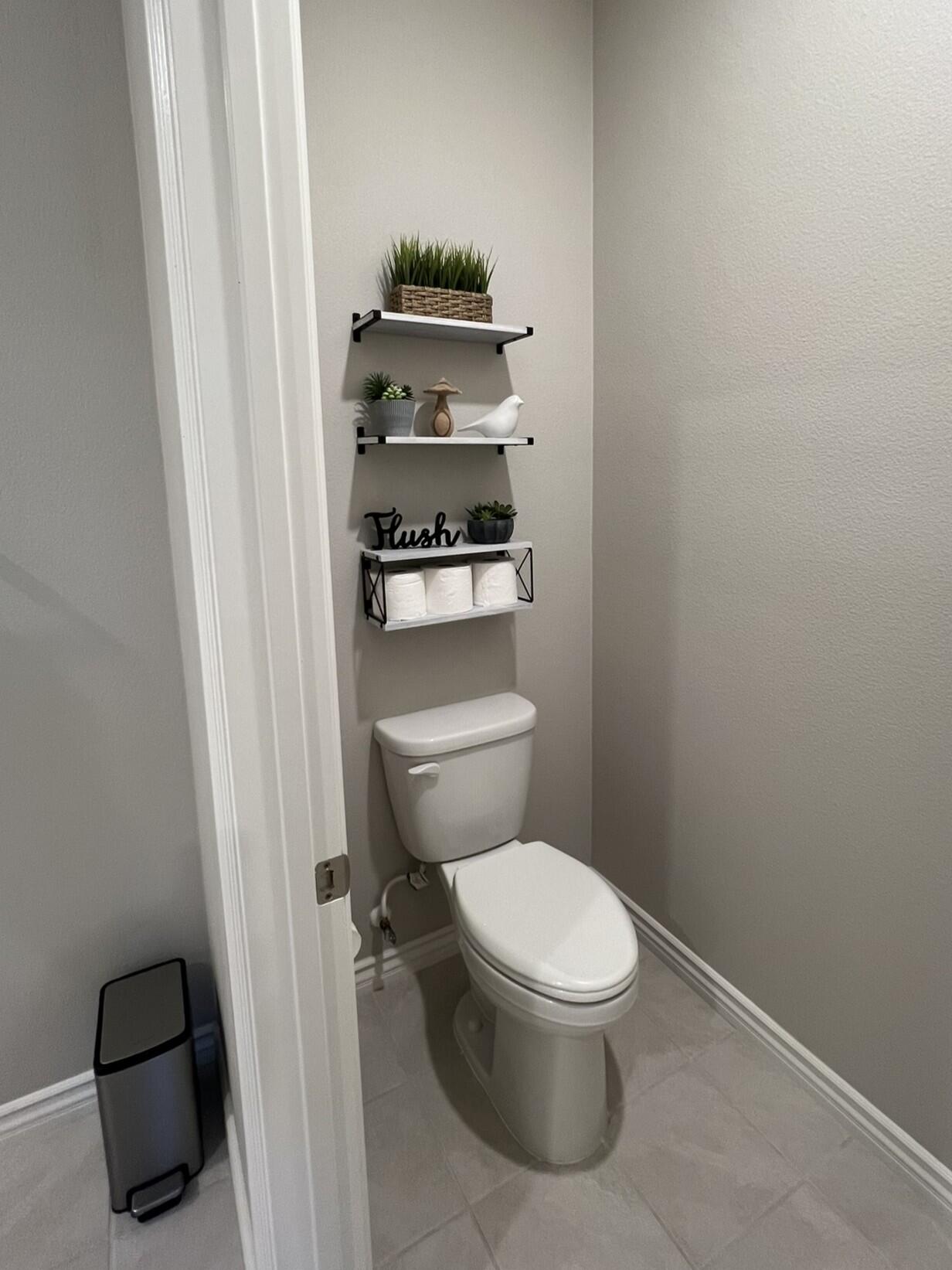 41867 Regona Road Indio, CA 92203 - Photo 15 of 65 a white toilet sitting next to a shower