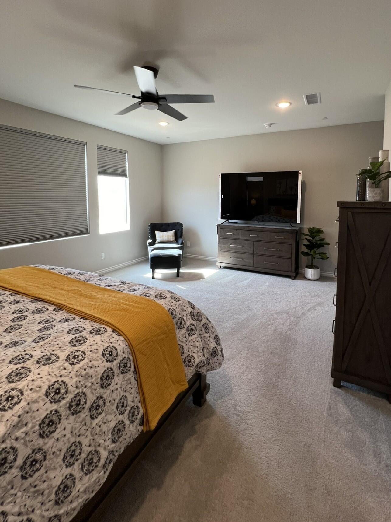 41867 Regona Road Indio, CA 92203 - Photo 17 of 65 a bedroom with a bed and a television in it