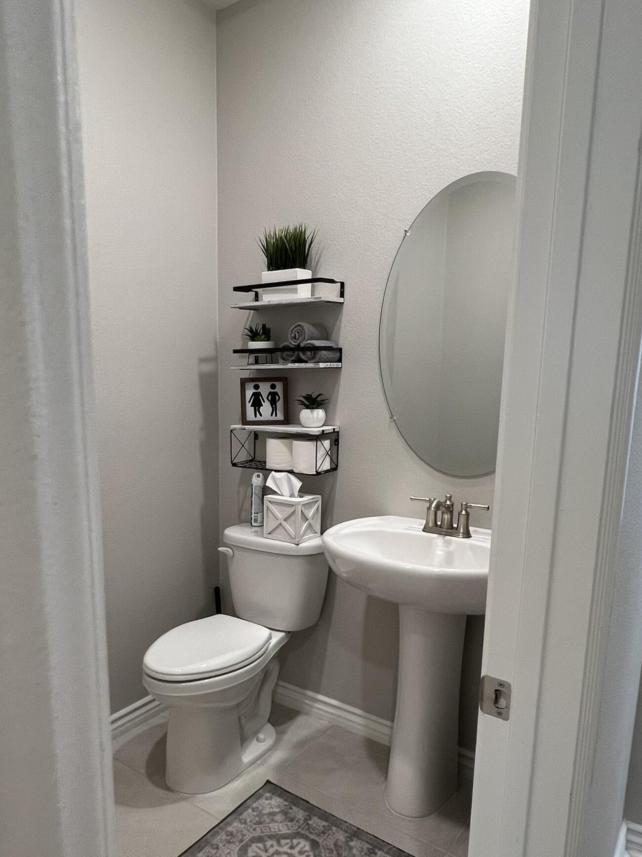 41867 Regona Road Indio, CA 92203 - Photo 19 of 65 a white toilet sitting next to a bathroom sink