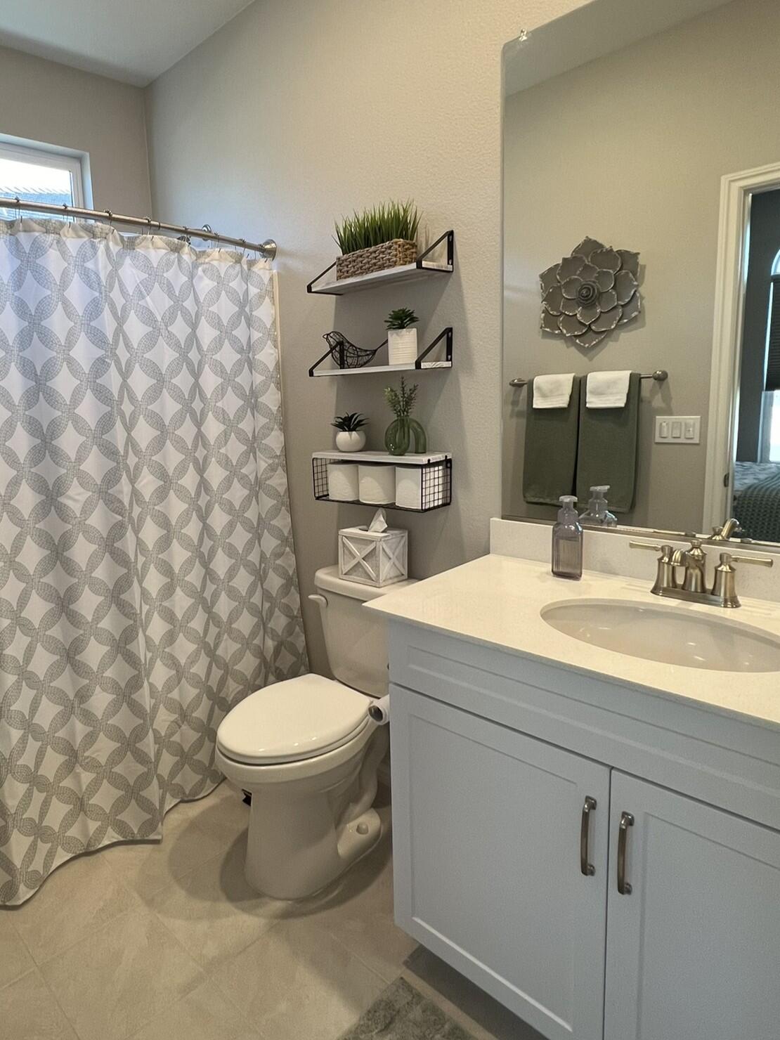 41867 Regona Road Indio, CA 92203 - Photo 27 of 65 a bathroom with a toilet sink and mirror