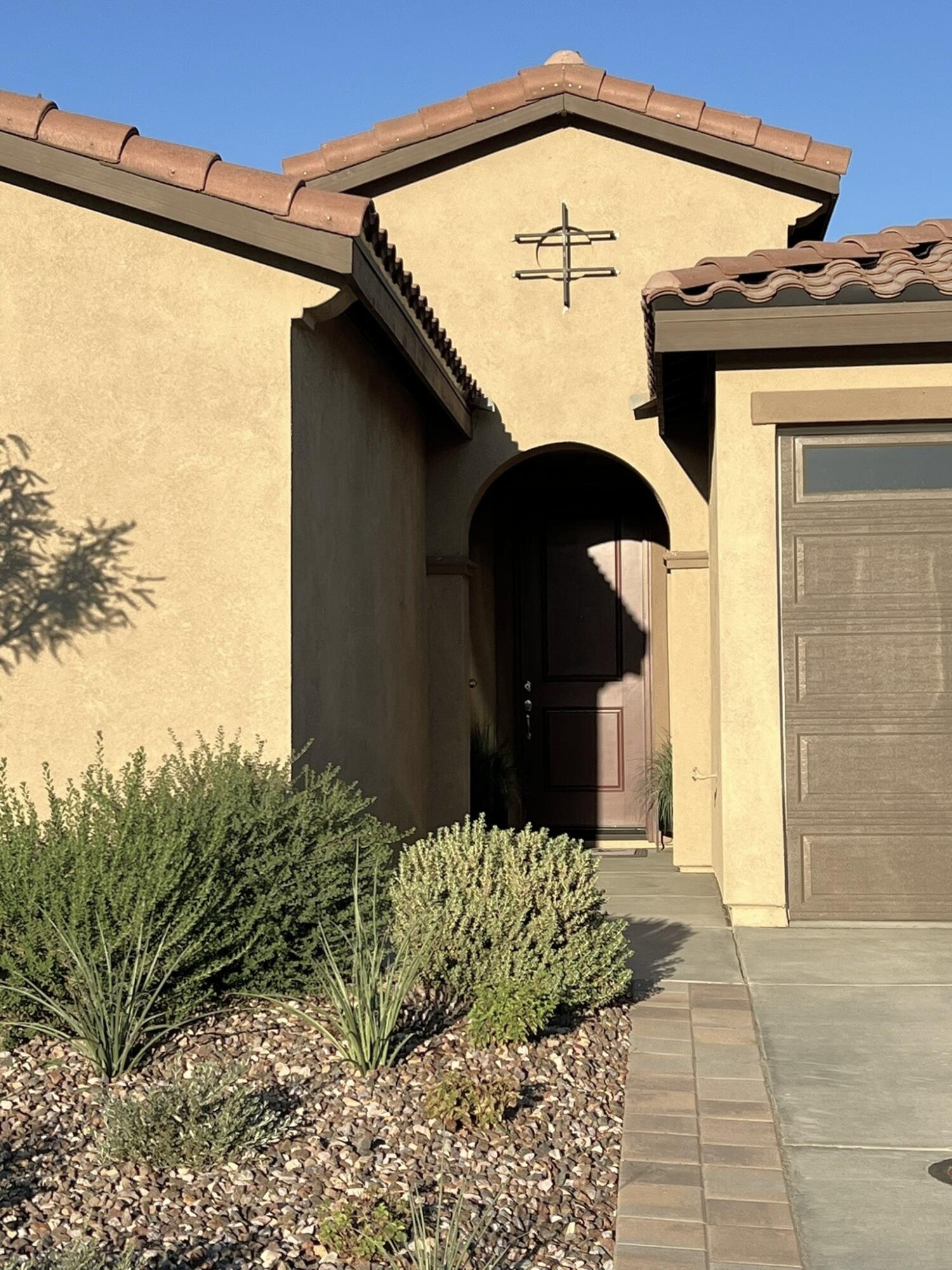 41867 Regona Road Indio, CA 92203 - Photo 3 of 65 a front view of a house with a yard