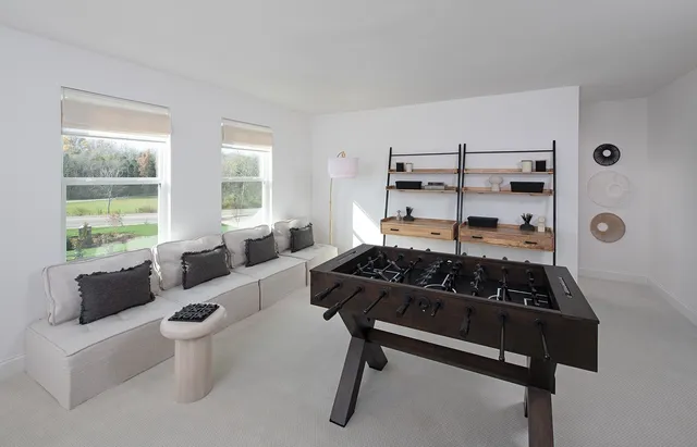 a view of a white house with large windows