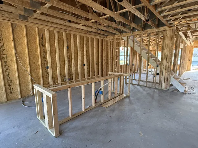 a view of an empty room with windows