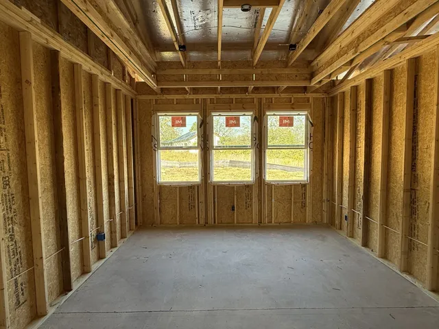 a view of a livingroom with furniture and front door