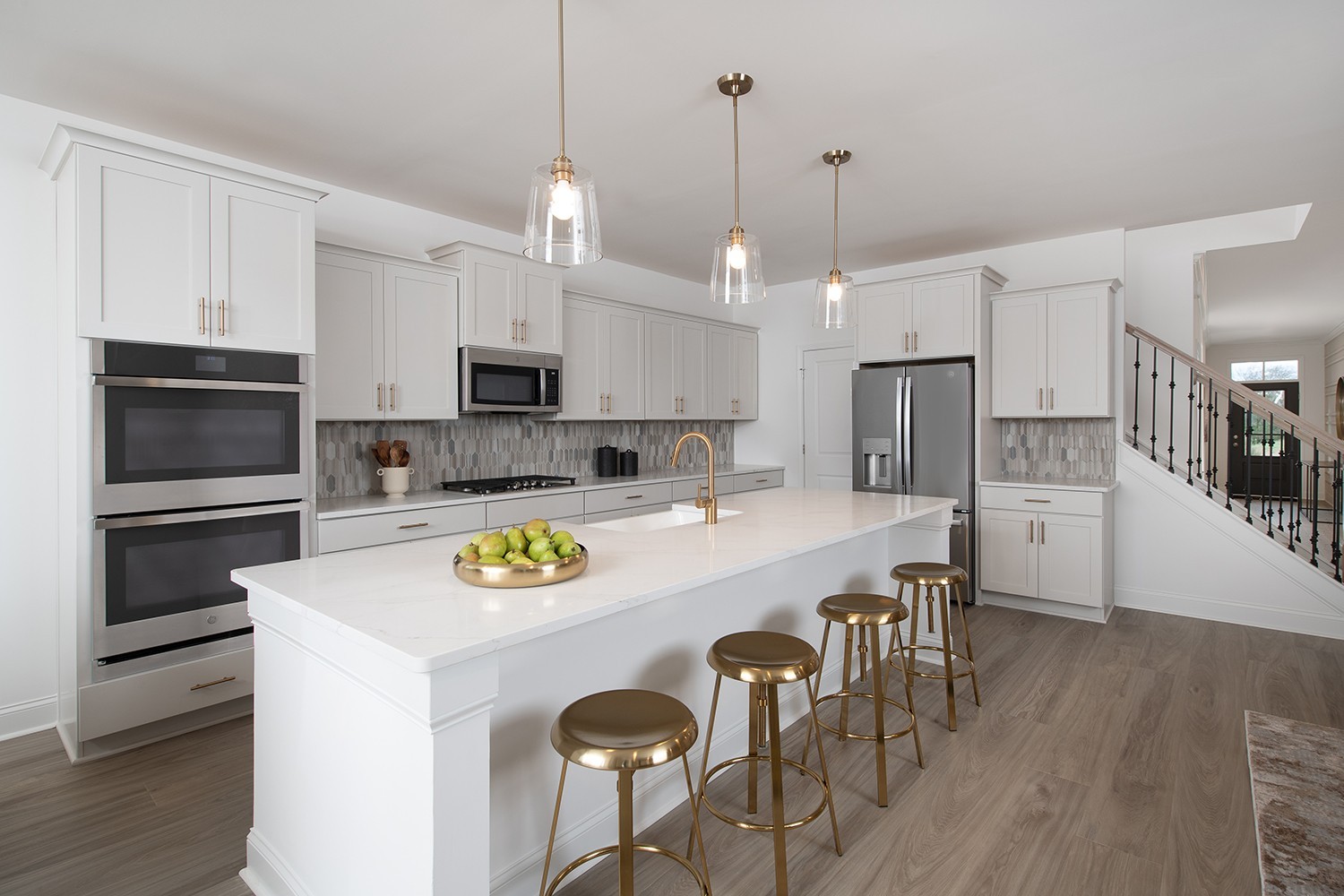 151 Emeline Way Mount Juliet, TN 37122 - Photo 6 of 51 a kitchen with kitchen island a stove a table and chairs