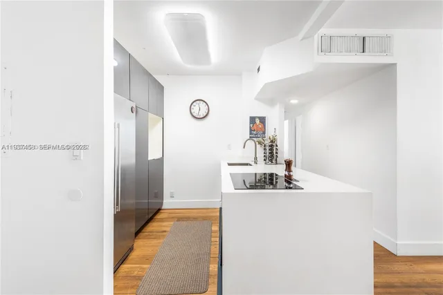 a view of a kitchen from the hallway