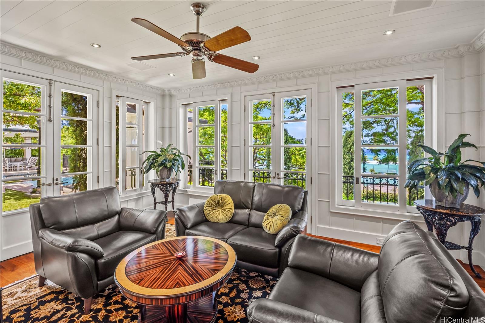2955 Makalei Place Honolulu, HI 96815 - Photo 8 of 25 a living room with furniture a chandelier and a large window